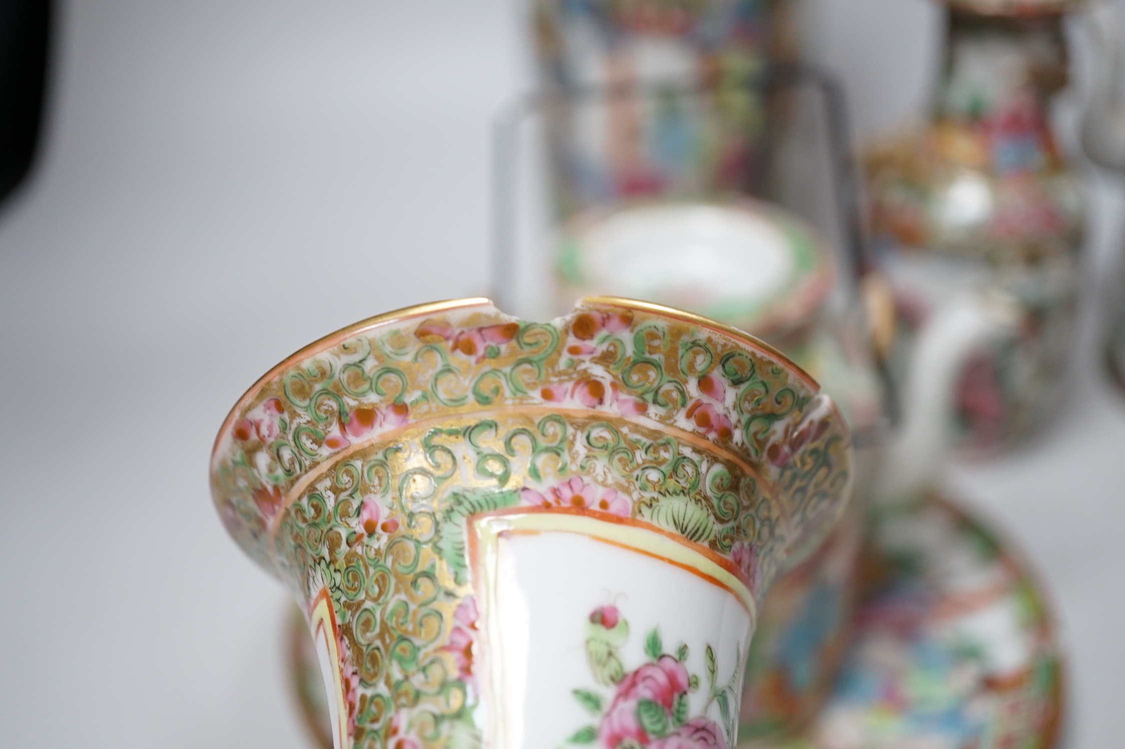 A collection of Chinese Cantonese famille rose vases, two teapots and a plate